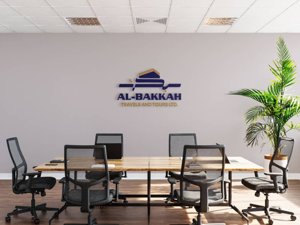 Al-Bakkah Travels & Tours office — professional, branded workspace with permanent team